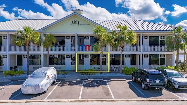 view of building exterior with uncovered parking