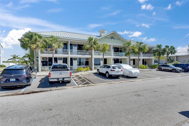 611 Destiny Dr Unit 304, Ruskin, FL 33570 - view of building exterior featuring uncovered parking