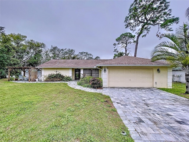 ranch-style house with stucco siding, an attached garage, decorative driveway, a pergola, and a front yard