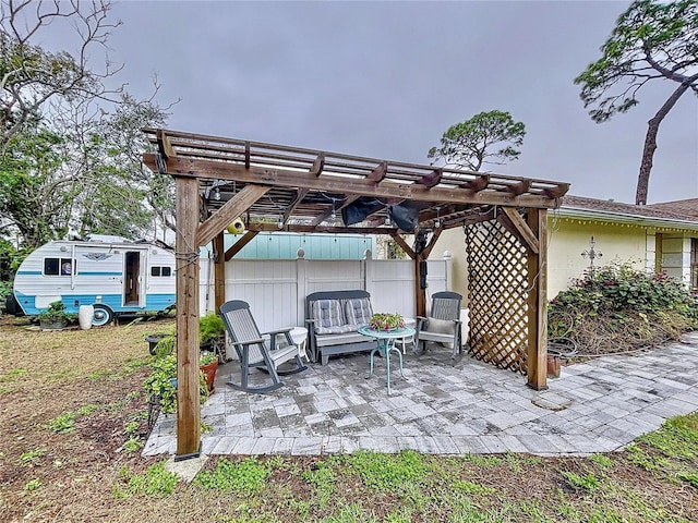 view of patio / terrace with fence and a pergola