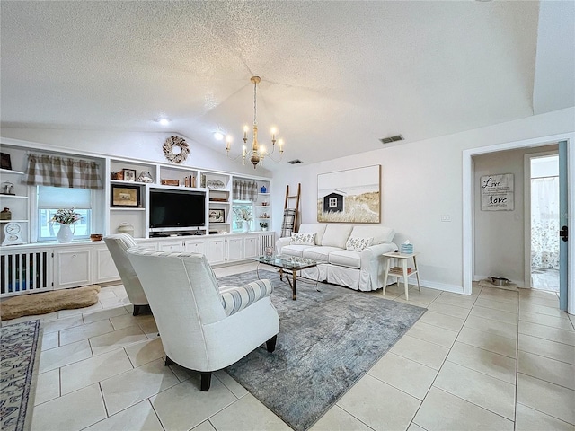 living area with visible vents, an inviting chandelier, light tile patterned flooring, vaulted ceiling, and a textured ceiling