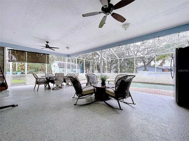 sunroom with a ceiling fan