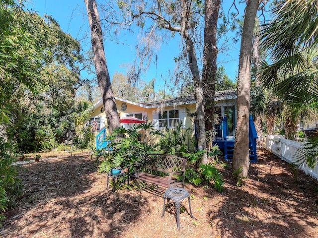 back of property featuring fence