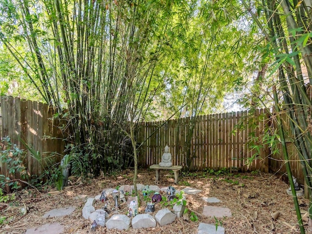 view of yard with a fenced backyard