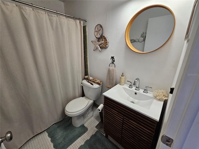 full bathroom with vanity, toilet, and tile patterned floors