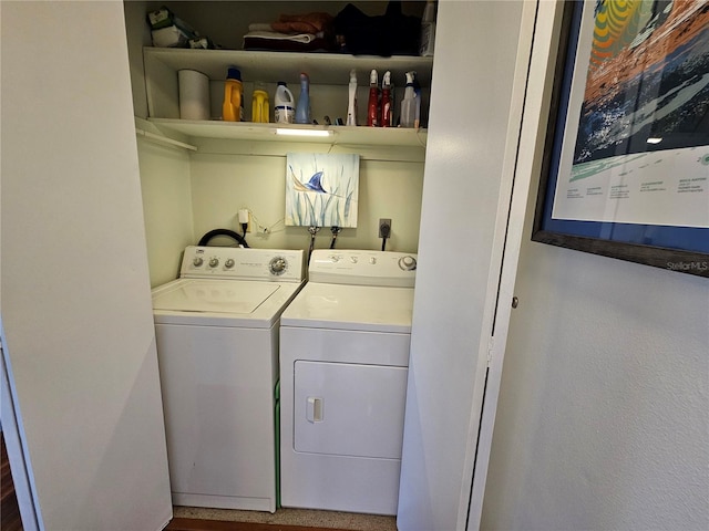 clothes washing area featuring laundry area and washing machine and clothes dryer