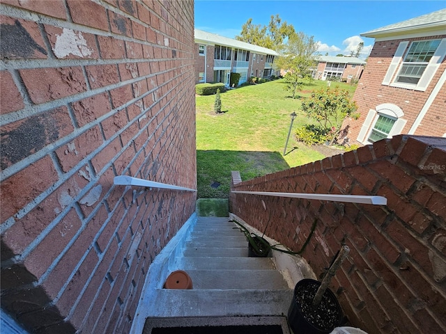 exterior space with brick siding