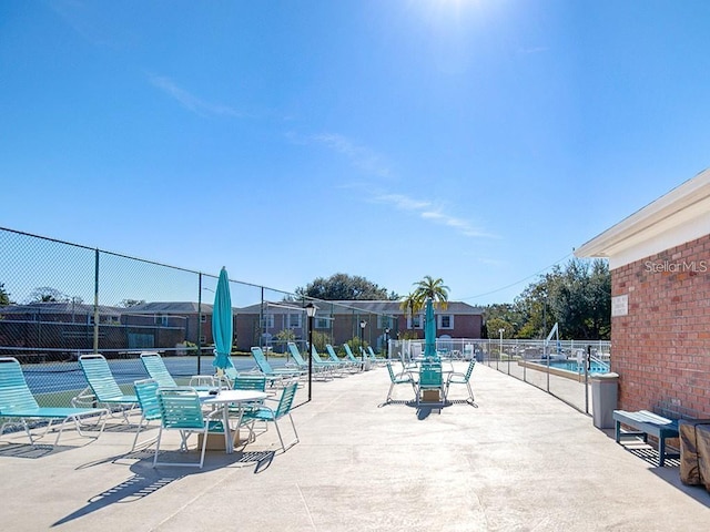 view of patio featuring fence