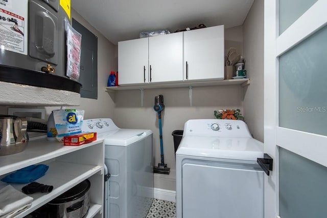 laundry area with independent washer and dryer, cabinet space, and baseboards