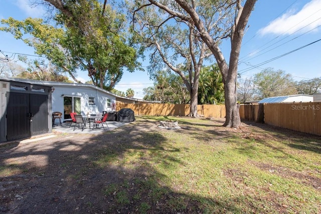 view of yard with a fenced backyard and a patio