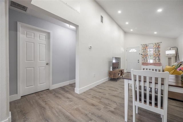 unfurnished bedroom with high vaulted ceiling, light wood-style flooring, recessed lighting, visible vents, and baseboards