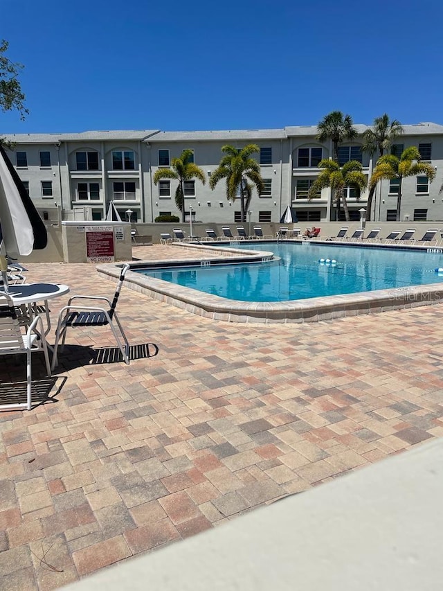 view of swimming pool with a patio area