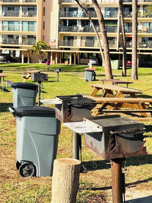 view of property's community with a lawn