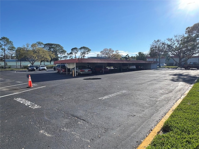 view of partially covered parking lot