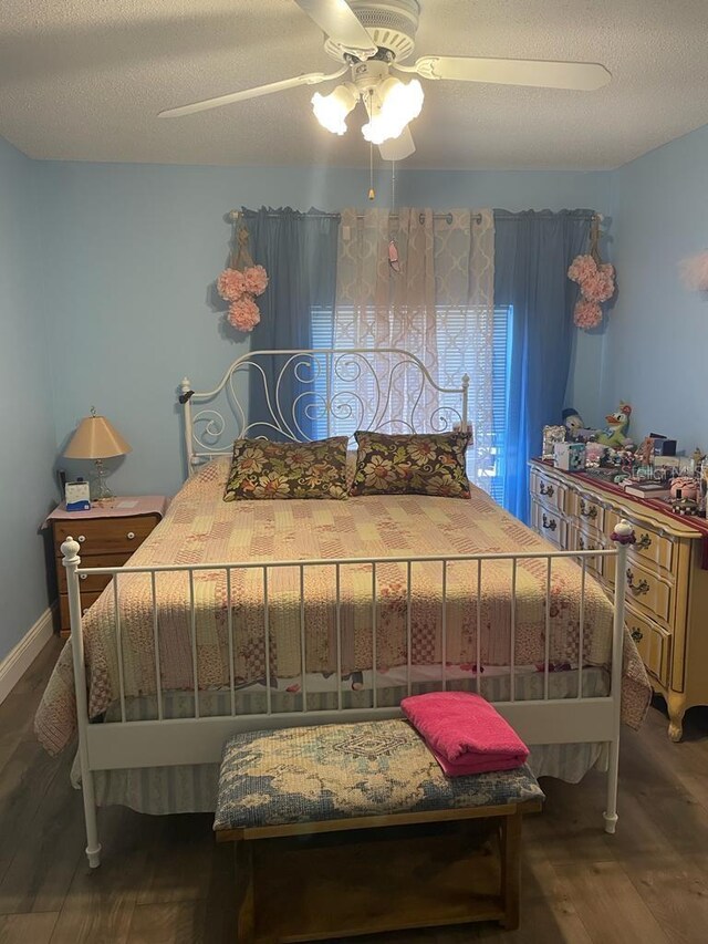 2700 Bayshore Blvd Unit 2308, Dunedin, FL 34698 - bedroom featuring wood finished floors, a ceiling fan, and a textured ceiling
