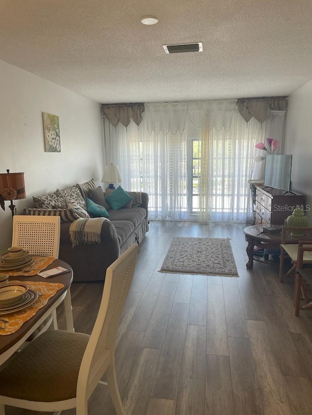2700 Bayshore Blvd Unit 2308, Dunedin, FL 34698 - living room with a textured ceiling and wood finished floors
