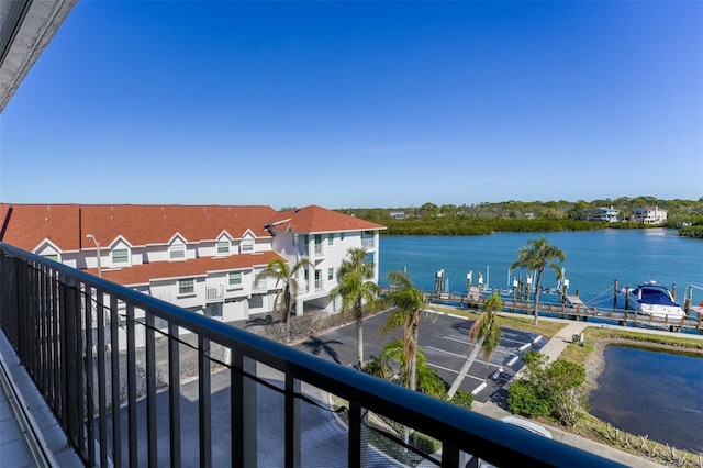 balcony featuring a water view