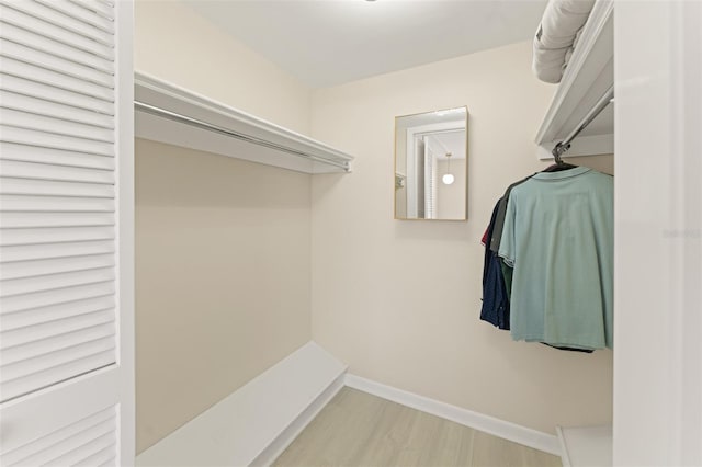 spacious closet with wood finished floors