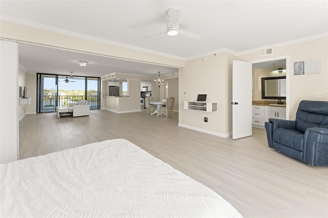 bedroom featuring crown molding, light wood-type flooring, baseboards, and an inviting chandelier