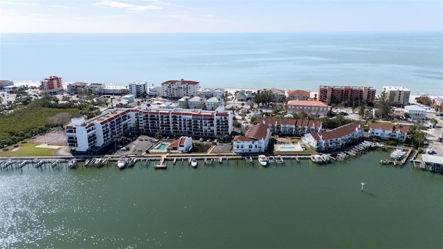 bird's eye view featuring a water view and a city view