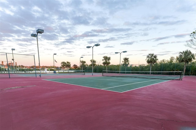 view of tennis court with fence