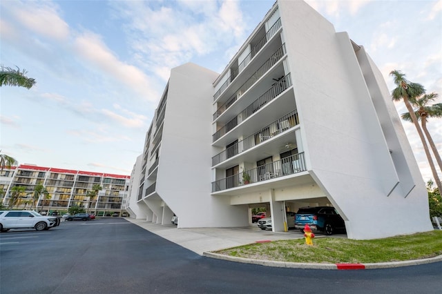 view of property featuring uncovered parking