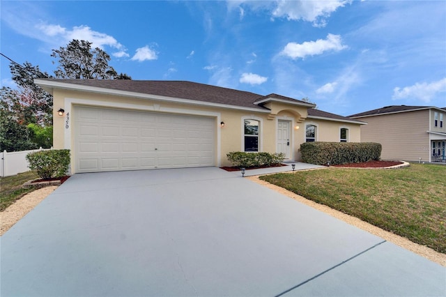 single story home featuring a front yard, concrete driveway, an attached garage, and stucco siding