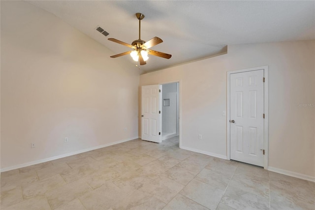 unfurnished bedroom featuring ceiling fan, baseboards, visible vents, and vaulted ceiling