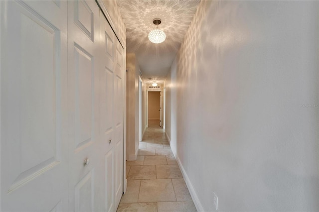 hallway featuring baseboards