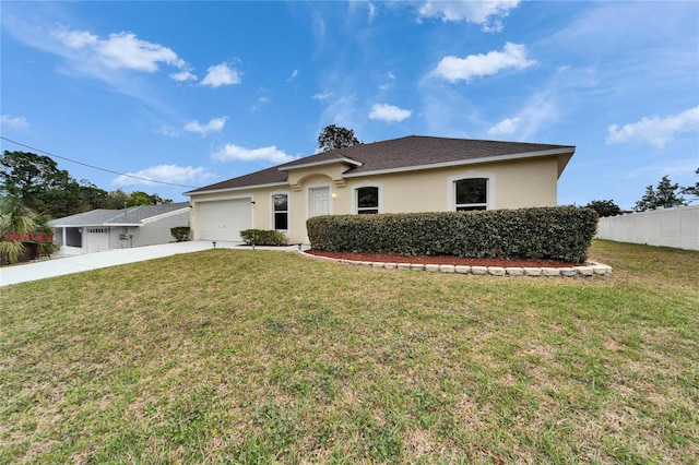 ranch-style house featuring a garage, fence, driveway, stucco siding, and a front lawn