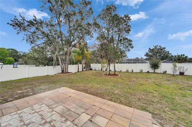 view of yard with a fenced backyard and a patio