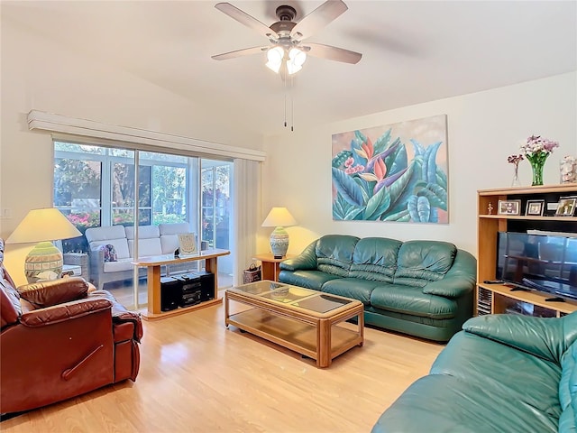 living area featuring wood finished floors and ceiling fan