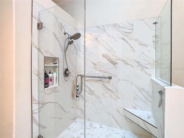 full bathroom with a marble finish shower