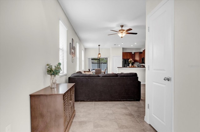 living room featuring recessed lighting and ceiling fan