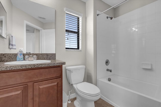 full bathroom with tile patterned floors, toilet, visible vents, vanity, and tub / shower combination