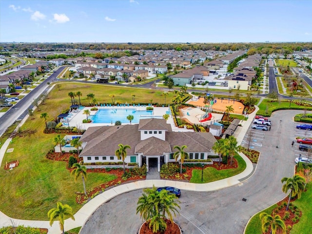 birds eye view of property with a residential view