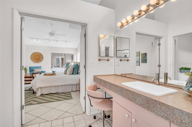 bathroom with vanity, a ceiling fan, tile patterned floors, ensuite bath, and track lighting