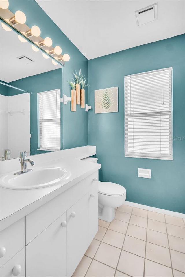 full bathroom featuring visible vents, vanity, tile patterned flooring, and toilet