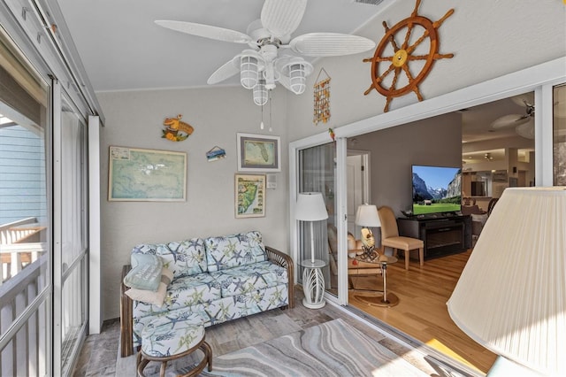 interior space featuring ceiling fan and wood finished floors