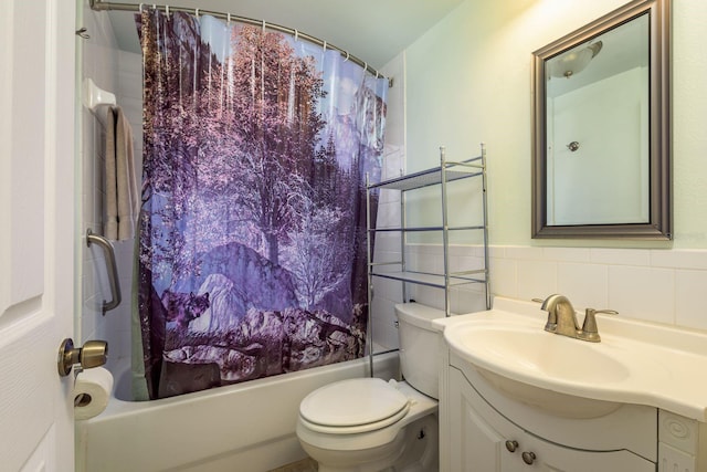 full bathroom featuring shower / bath combination with curtain, vanity, toilet, and tile walls