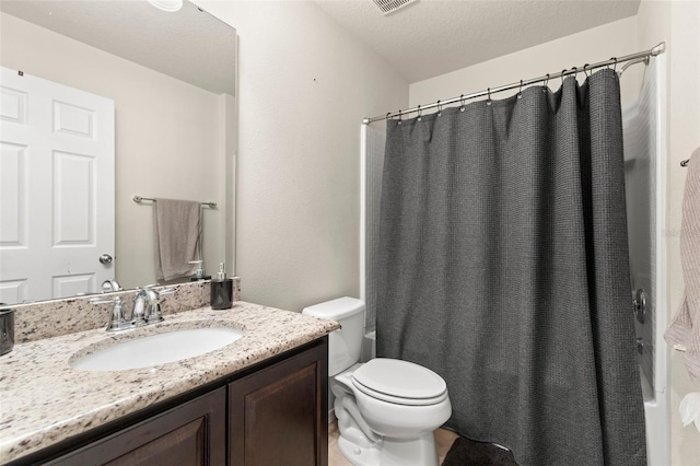 full bathroom with a textured ceiling, toilet, shower / tub combo, visible vents, and vanity