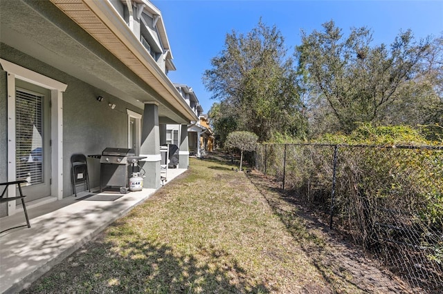 view of yard featuring a patio area and a fenced backyard