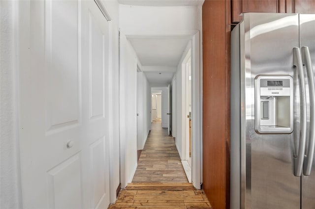 corridor featuring light wood-style flooring