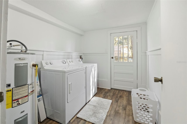 washroom featuring laundry area, wainscoting, dark wood-type flooring, independent washer and dryer, and water heater