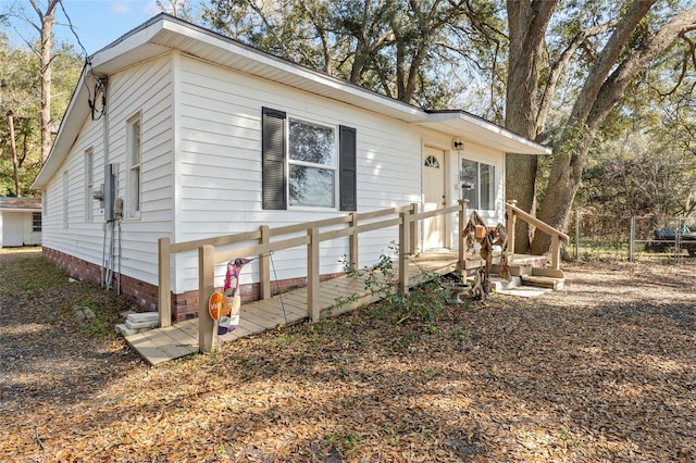 view of front of home featuring fence