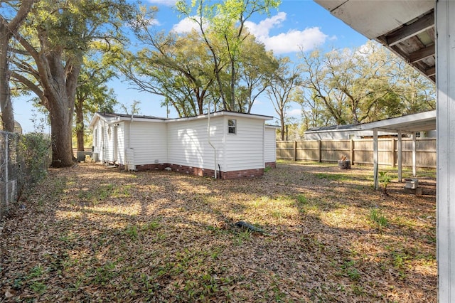 view of yard featuring a fenced backyard and an outdoor structure