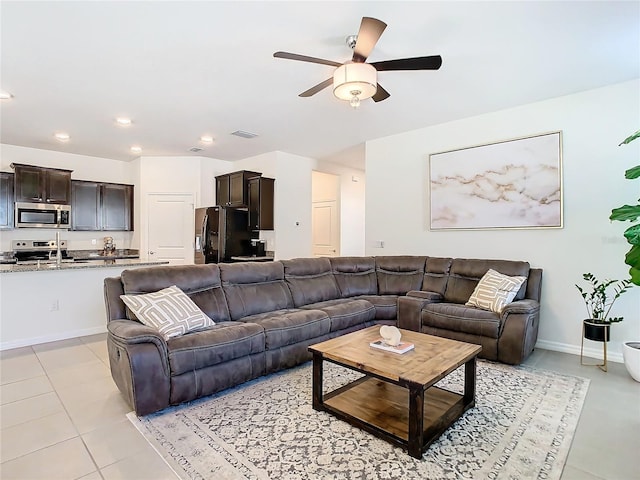 living room with light tile patterned floors, recessed lighting, visible vents, a ceiling fan, and baseboards