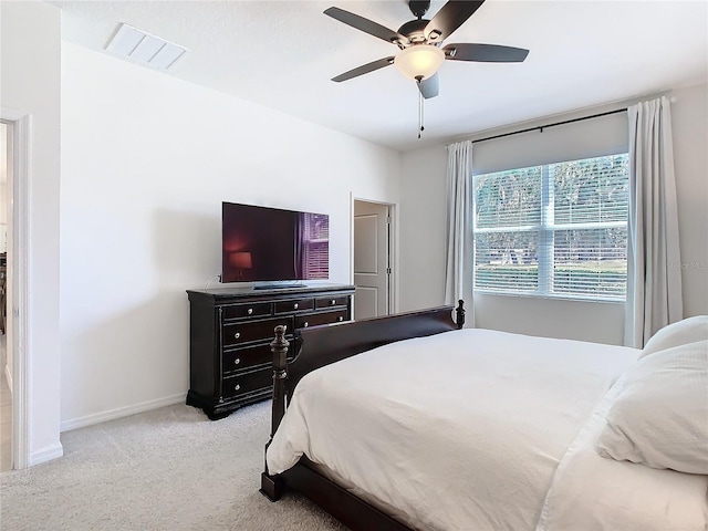 bedroom with baseboards, visible vents, ceiling fan, and carpet flooring