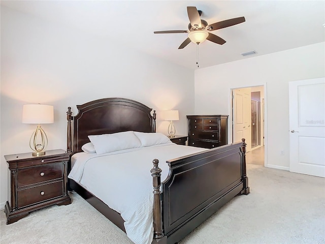 bedroom with baseboards, visible vents, ceiling fan, and light colored carpet