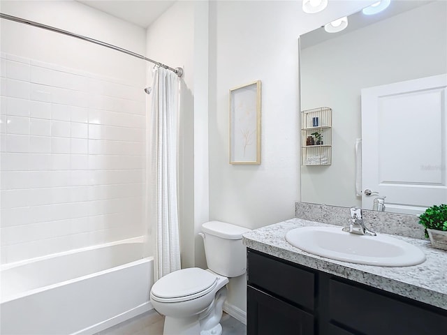 bathroom with shower / bathtub combination with curtain, vanity, and toilet